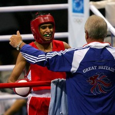 Amir Khan of Great Britain hugs his coach Terry Edwards after defe- Old Photo