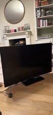 Panasonic Viera 42-inch TV with Built-In Stand and Remote Control