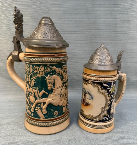 Pair of German Steins - Ceramic and Pewter w/ Medieval Themes