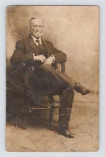 RPPC Old Man Suit Tie Eyeglasses Chair Gentleman Real Photo Postcard 1906 - 1915