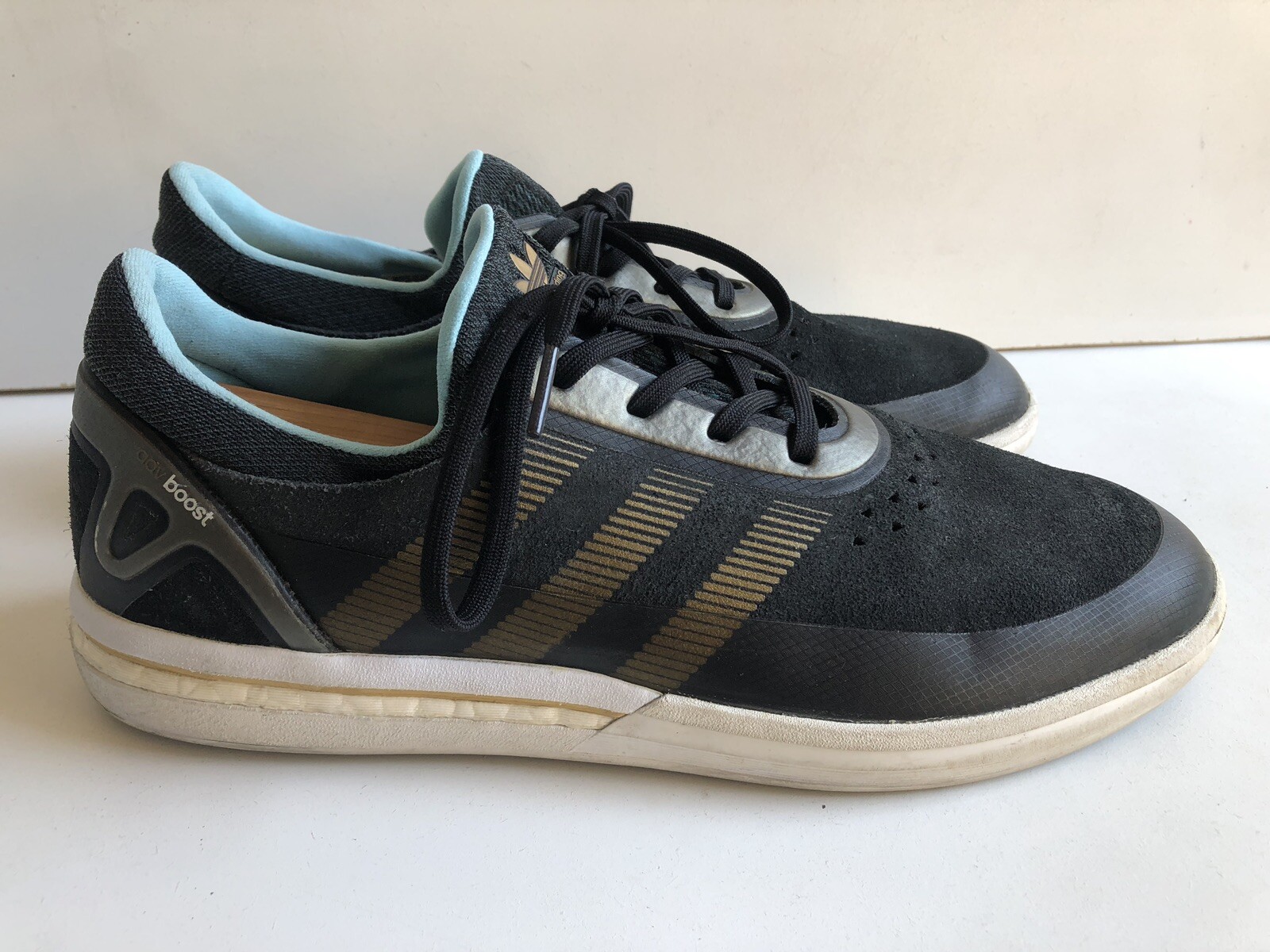 black gold adidas trainers