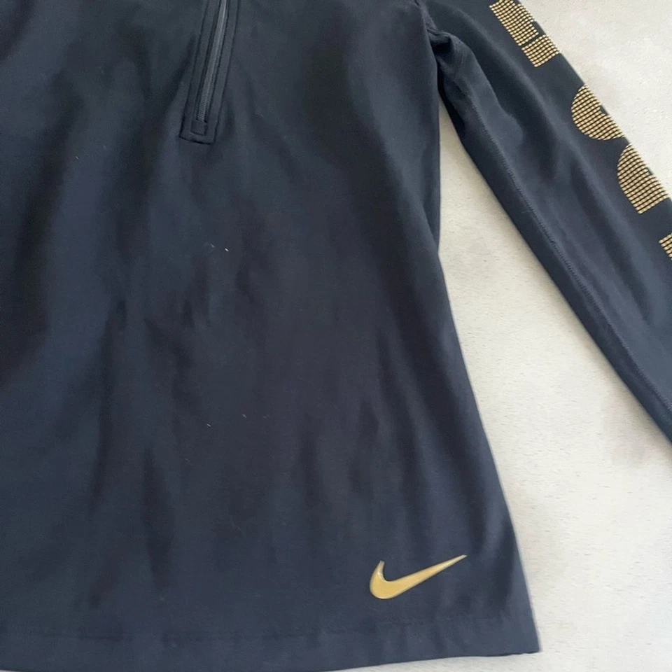 Camiseta para correr Nike Dri‐FIT Therma "Just Do It" dorada 1/4 cremallera manga larga para mujer XS Foto 3 de 4