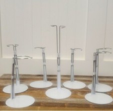 7 White metal doll stands