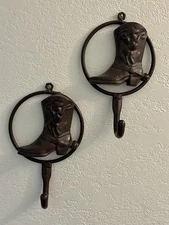 2 Brown Cast Iron Cowboy Boot Wall Hooks Featuring Bucking Bronco Motif