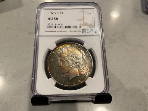 1923-S AU 58 Peace Silver Dollar $1 NGC TONED