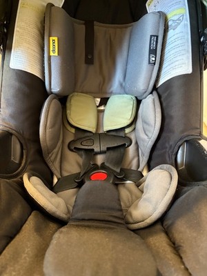 Green doona stroller Used in great conditions comes with base expired 2028