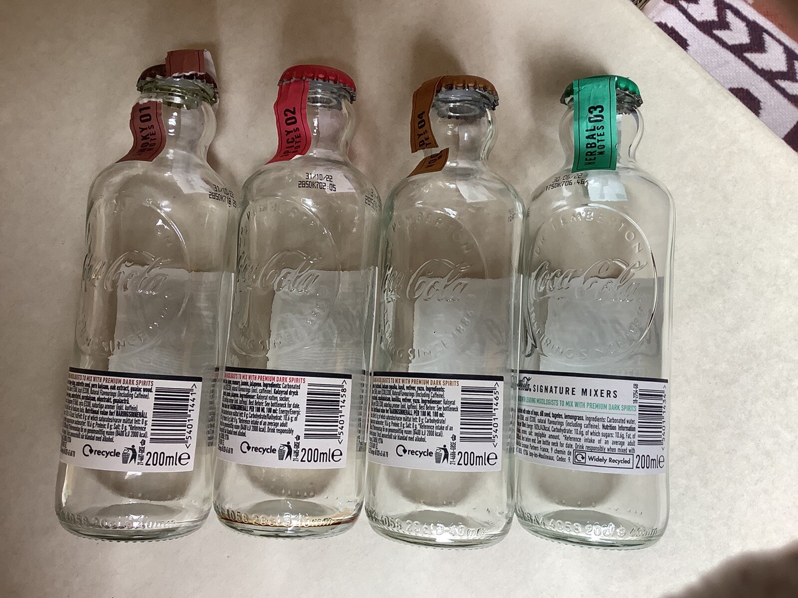 CocaCola Signature Mixers Set 4 empty glass bottles Smoky Woody Herbal