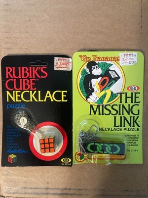 1982 RUBIK S CUBE NECKLACE & GO BANANAS THE MISSING LINK NECKLACE NIC BY IDEAL