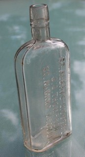ST ALBANS LIQUOR CO J J THOMPSON ST ALBANS VERMONT Emossed Clear Flask