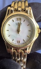 white dial citizen womens roman numerals gold bezel watch