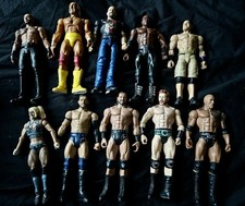 11 WWE Wrestling Action Figures With Smackdown Ring, And A Large Undertaker
