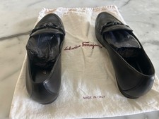 ferragamo size 7 lamb skin loafers with designer black plaque on shoes.