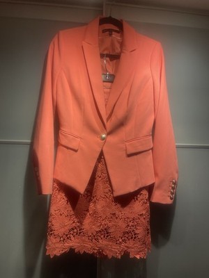 I sell a suit of the brand White and Black,   size 8 Price 40 , Color : Peach