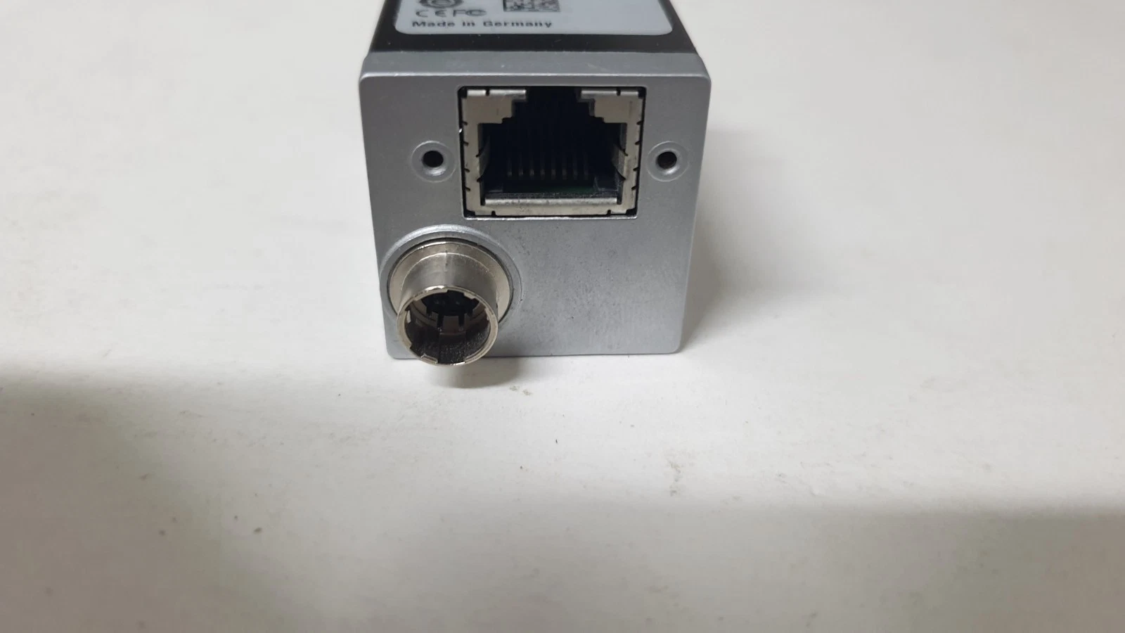 Rear of the Basler acA1600-60gc: RJ45 GigE port and round I/O power connector