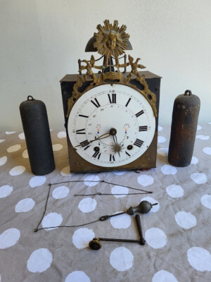 MECANISME D'HORLOGE COMTOISE AU SOLEIL