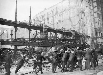Firefighters rank their equipment after putting out fire at Grand - Old Photo