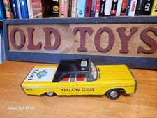 VERY NICE 1960'S TIN LITHO  FRICTION POWERED PLYMOUTH  NEW YORK YELLOW CAB TAXI