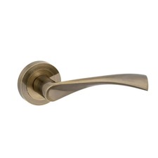 Marvel Curved/Twisted Lever Door Handle on Rose - Antique Brass - Fire Rated