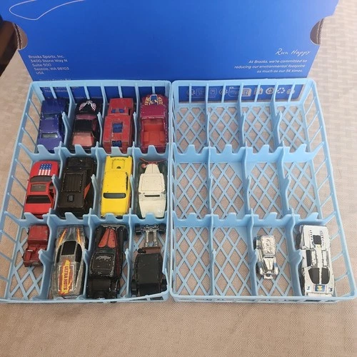 Hot Wheels/Matchbox 1970's-1980s. Lot w/14 vehicles. Both blue holders as well.