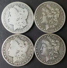 1884, 1900 O, 1901 O, and 1902 O $1 Morgan Silver Dollars
