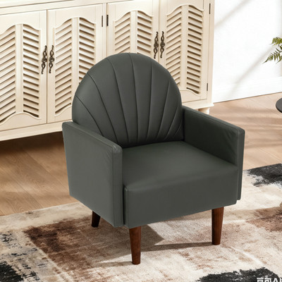 Armchair with PU leather upholstery, wooden legs, and a shell-shaped backrest