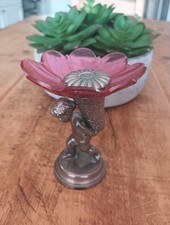 Silver And Cranberry Statue