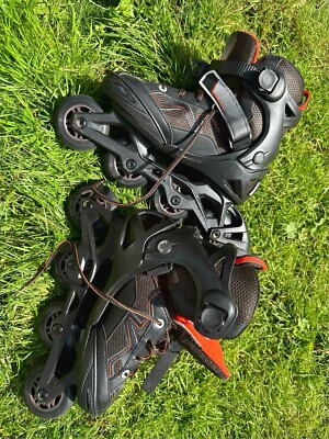 Schwarz und Orange Oxelo Fit 3 Kinder Fitness Skates