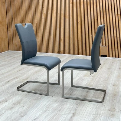 Furniture Village ‘Bianco’ Pair of Dining Chairs Grey Faux Leather Cantilever - Image 1 of 4