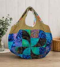 A balloonshaped bag made from batik fabric Perfect for going out a cute outfit
