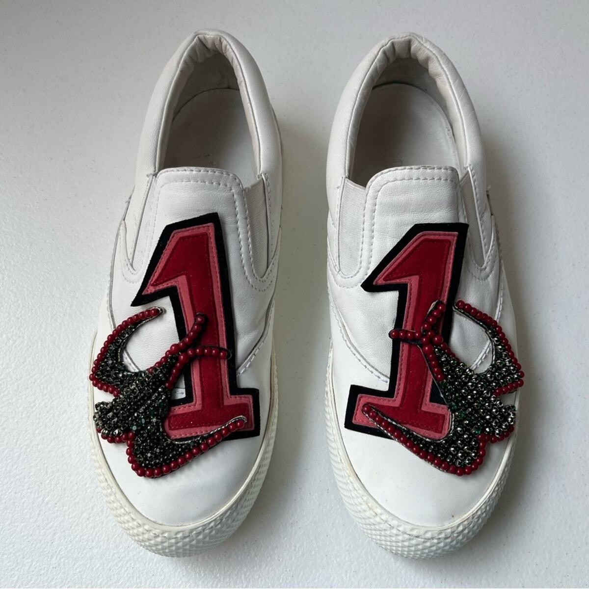 Miu Miu Embellished Patch Logo Slip-On Leather Sneakers Miu Miu Embellished Patch Logo Slip-On Leather Sneakers
