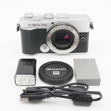 Shot count: 1365. Excellent condition OLYMPUS PEN E-P7 body, silver.