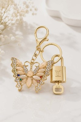 Louis Vuitton Gold Lock   Authentic LV Padlock + Bag Unbranded Butterfly Charm