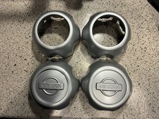 Genuine Oem Nissan Center Caps. Set Of 4. 2 Of 40315-2z900 And 2 Of 40315-7z100.