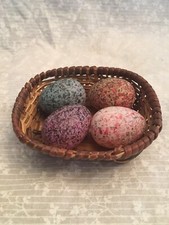 wicker basket of colored eggs.  Plastic eggs ...