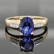 ANELLO TG. 16 (CIRCA 50) IN ORO GIALLO 375/- CON TANZANITE E DIAMANTI CACCIA GIOIELLI