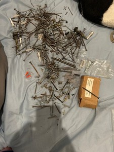 A bag of nails, screws and pins