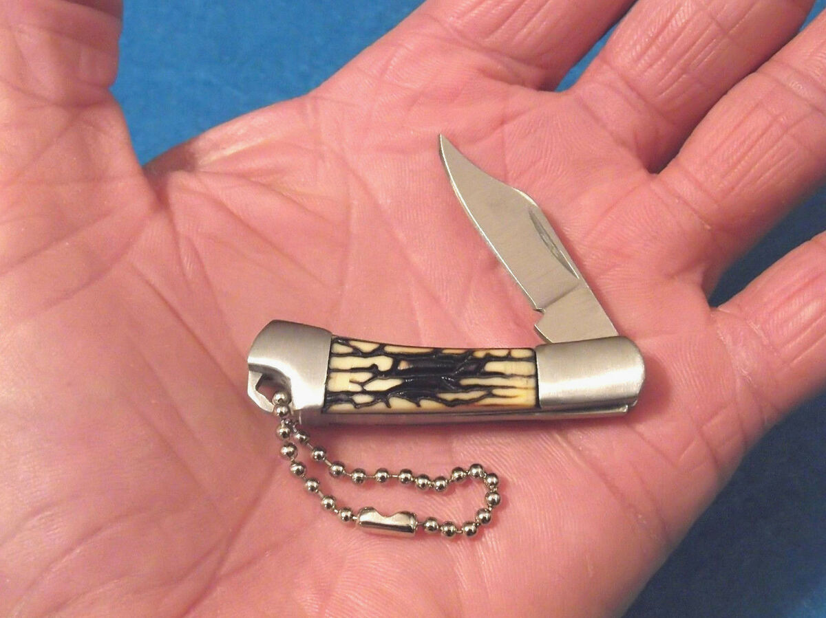 SZCO 210950 Jigged Bone Mini Keychain Clip Point Folding SZCO 210950 Jigged Bone Mini Keychain Clip Point Folding