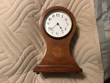 Edwardian mahogany "balloon" mantel clock, has lion on movement, please look