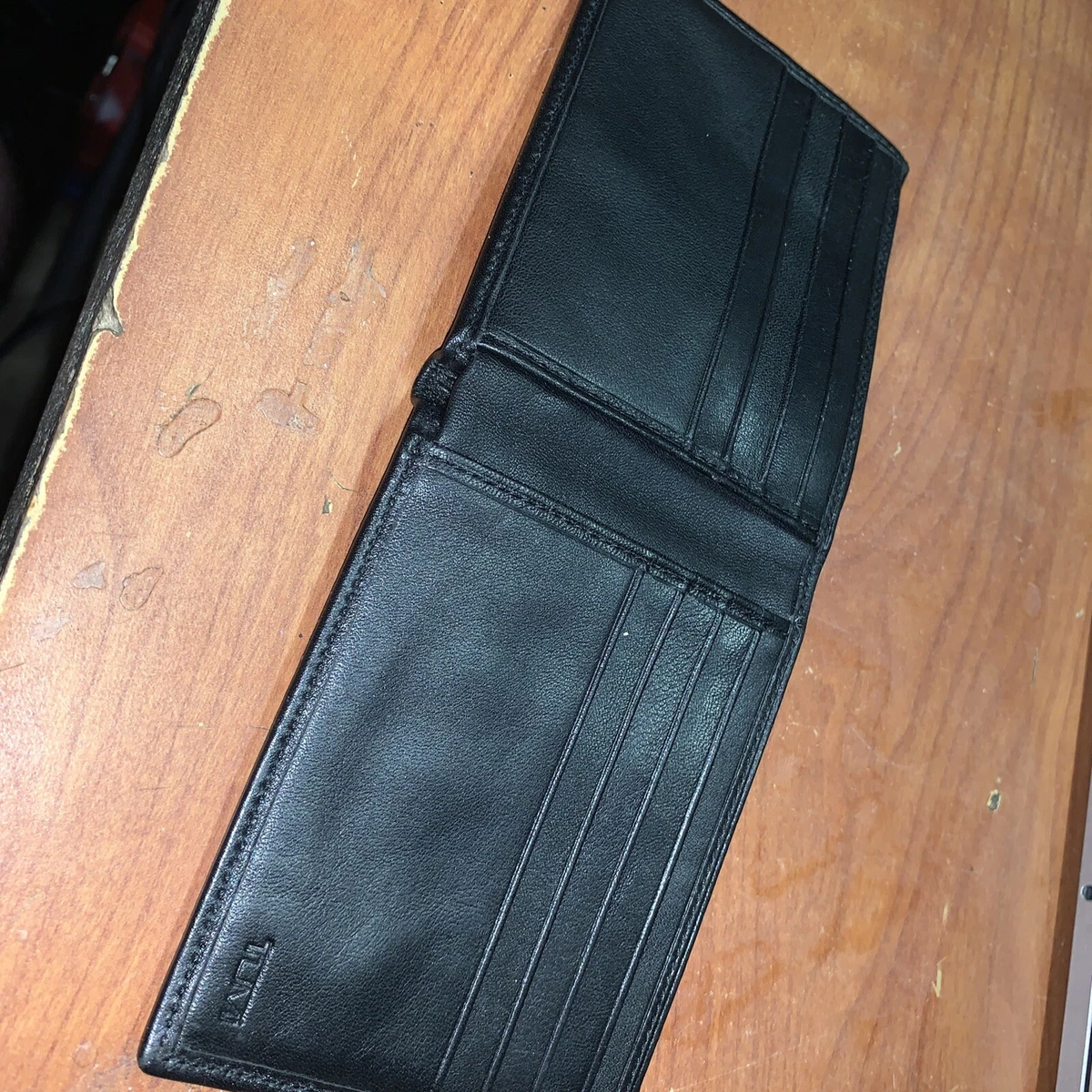Tumi Delta RFID Black leather Slim Single Billfold Wallet With Red