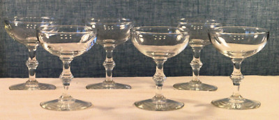 6 matching clear champagne glasses