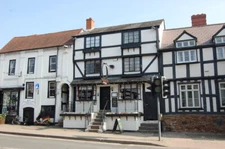 Photo 6x4 Horseshoe Pub, The Homend Ledbury Powells cycle shop next to th c2009