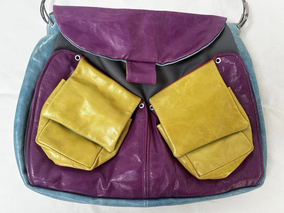 Bolso/cartera de cuero colorido Cirque Du Soleil con mango de correa de alambre guía juguetón Foto 3 de 4