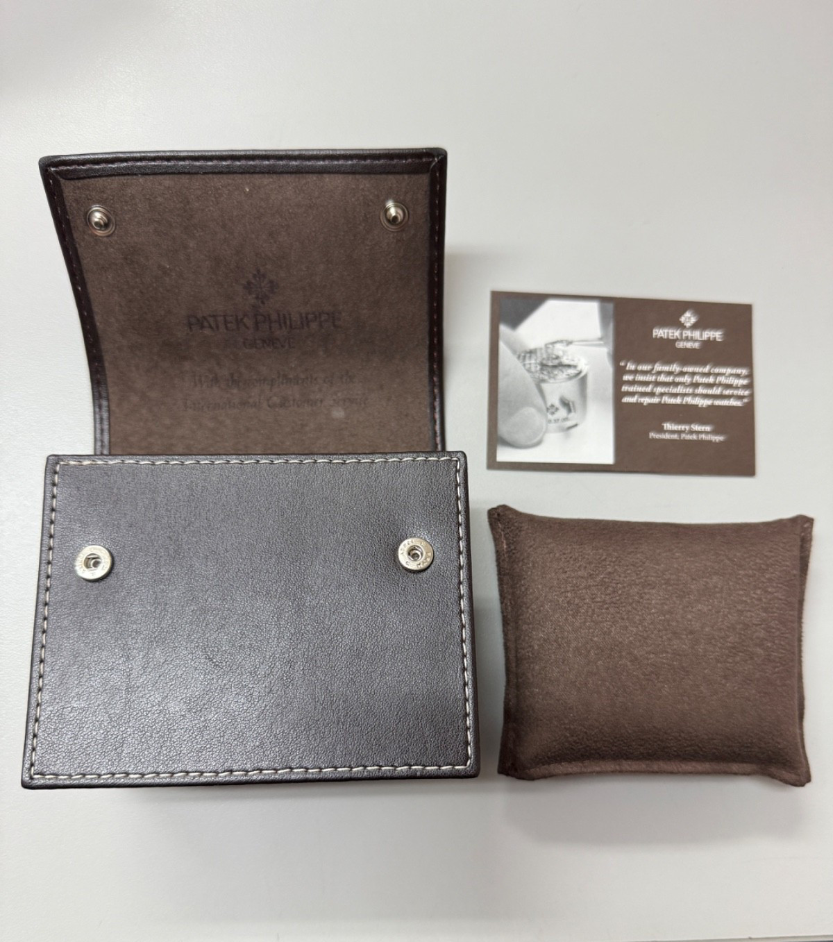 PATEK PHILIPPE, brown travel leather case, pouch and New and