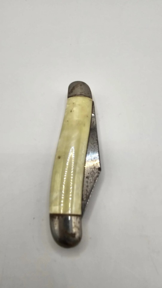 A stunning 1940s Imperial USA pocket knife with a yellow swirl 'cracked ice' celluloid handle — a visually jaw-dropping piece of pre-war American craftsmanship.