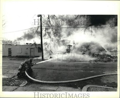#ad 1996 Press Photo Firefighter Using Hose on Fire nod04285 $24.99