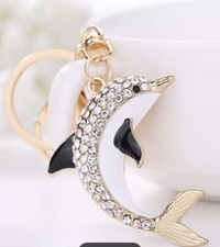 DOLPHIN KEY CHAIN, SHINING CRYSTAL DOLPHIN ON GOLD COLOR BASE. HIGH END QUALITY.