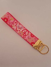 Pink peace sign print key fob wristlet