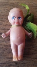 VINTAGE CELLULOID KEWPIE DOLL. 2 INCH BLUE WINGED KEWPIE DOLL. STAMPED ON BACK