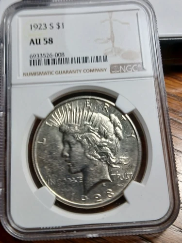 1923-S Peace Silver Dollar NGC AU58.