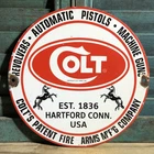 VINTAGE 1961 DATED COLT FIREARMS REVOLVERS PISTOLS GUNS 10” PORCELAIN GAS SIGN